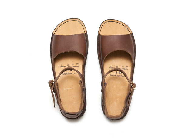 Brown New Mexican handmade leather sandals by Aurora Shoe Co. - top down orientation on white background.