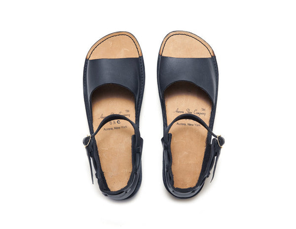 Navy New Mexican handmade leather sandals by Aurora Shoe Co. - top down orientation on white background.