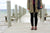 Woman standing on dock in the Village of Aurora, at Cayuga Lake, wearing black leggins and brown Middle English Handmade Leather Shoes by Aurora Shoe Co.