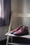 Brown North Pacific leather shoes sitting on antique chair with soft light from adjacent window